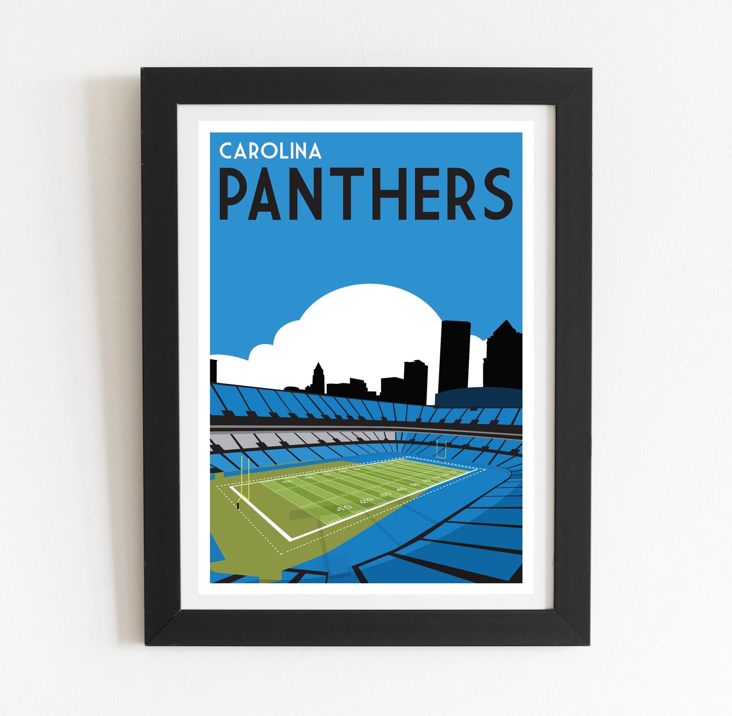 a framed poster of a stadium with a tennis court