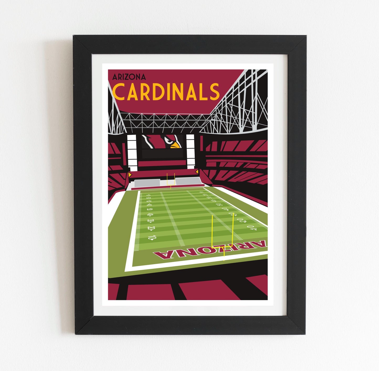 a framed poster of a stadium with a football field