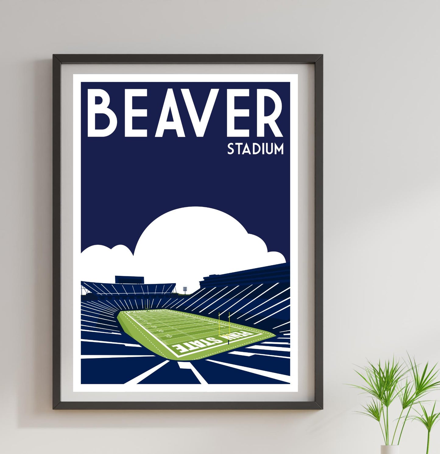 a framed poster of a stadium with a green field