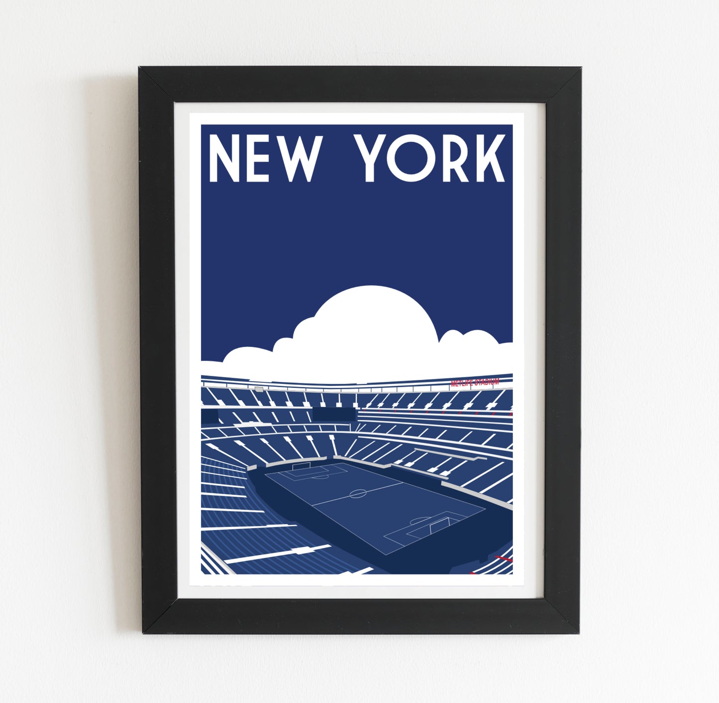 A framed illustration of a soccer stadium with the text "NEW YORK" prominently displayed above it.