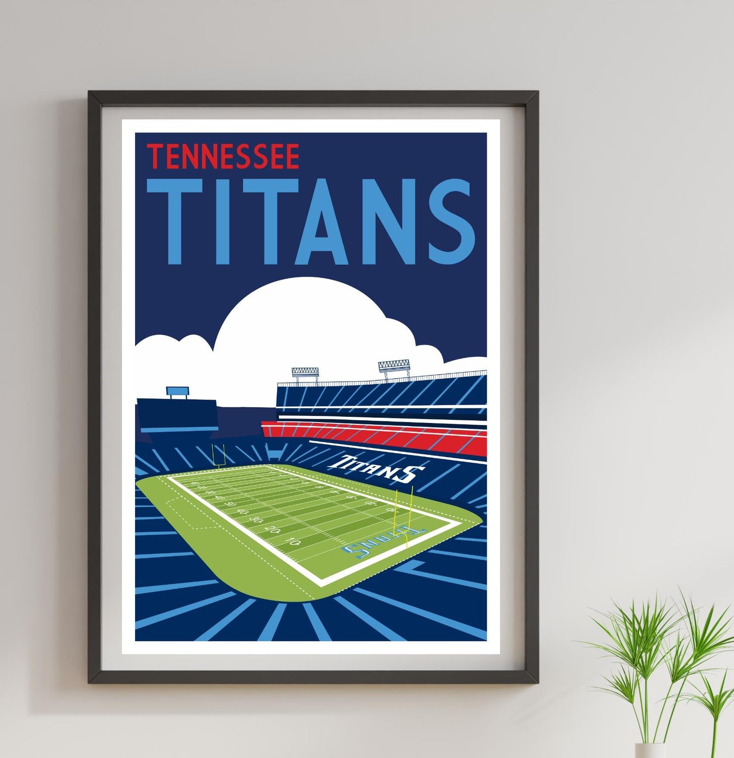 a framed poster of a football stadium