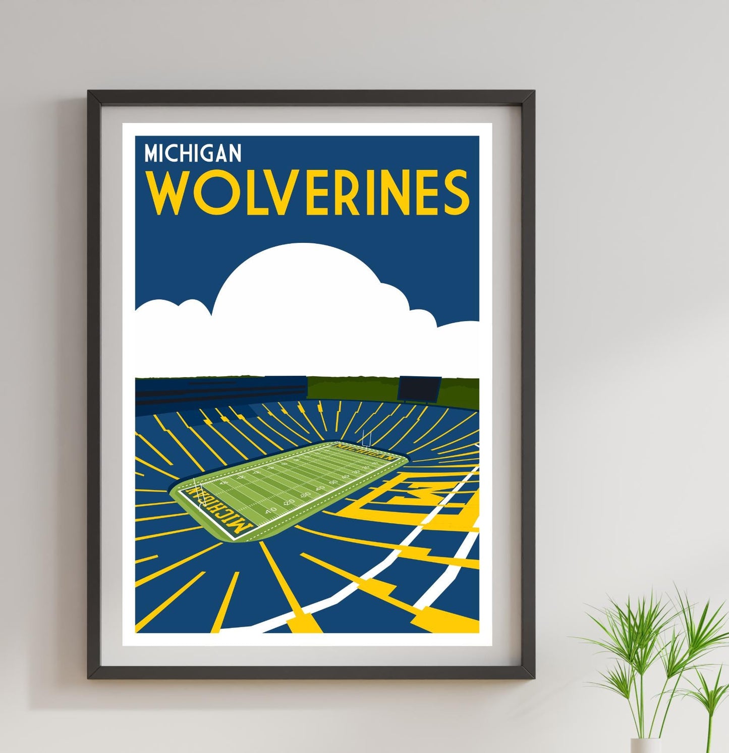 a framed poster of a stadium with a green field