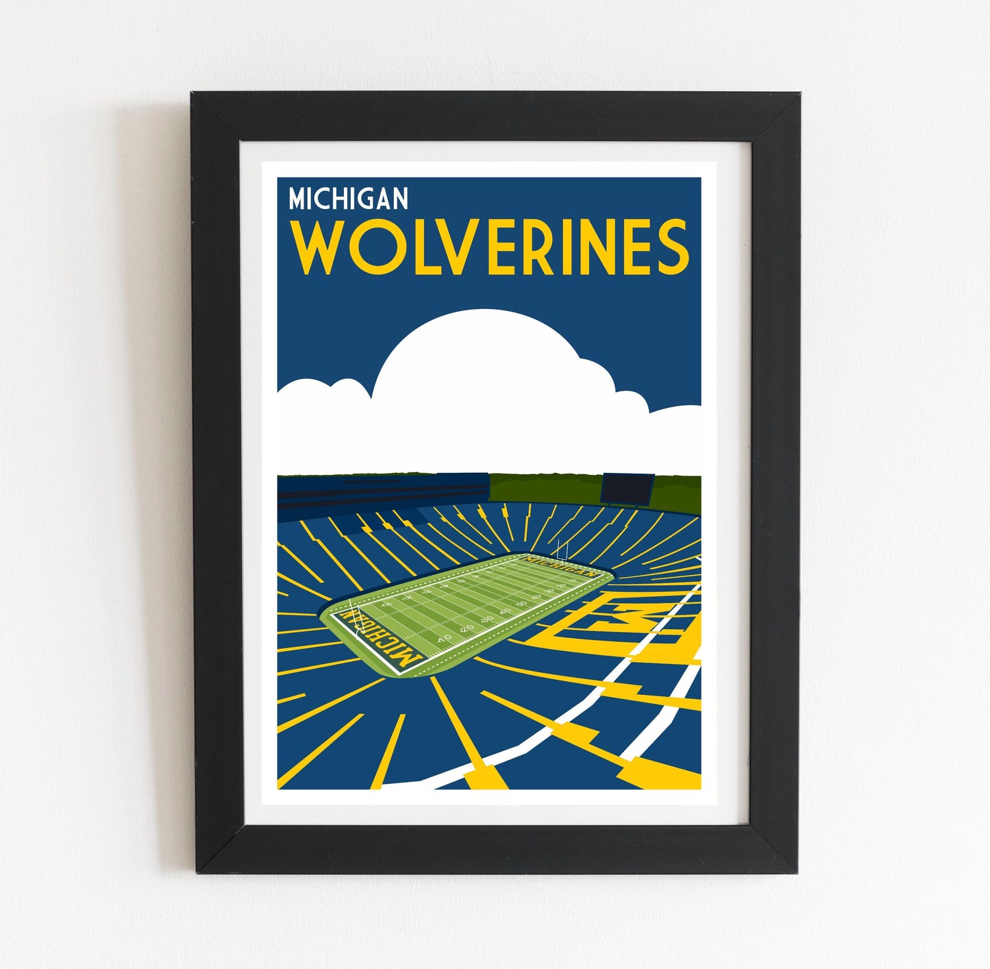a framed poster of a tennis court with the words michigan wolverines on it
