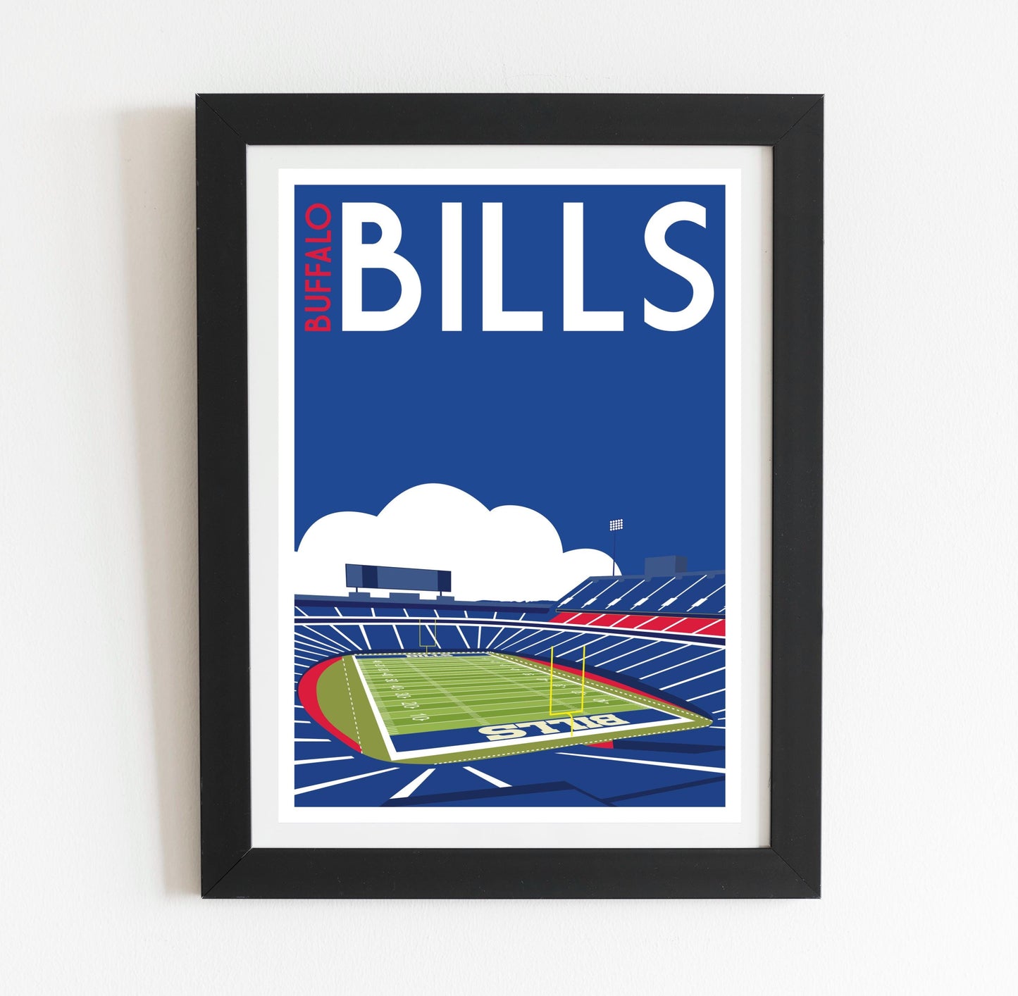 a framed poster of a football stadium
