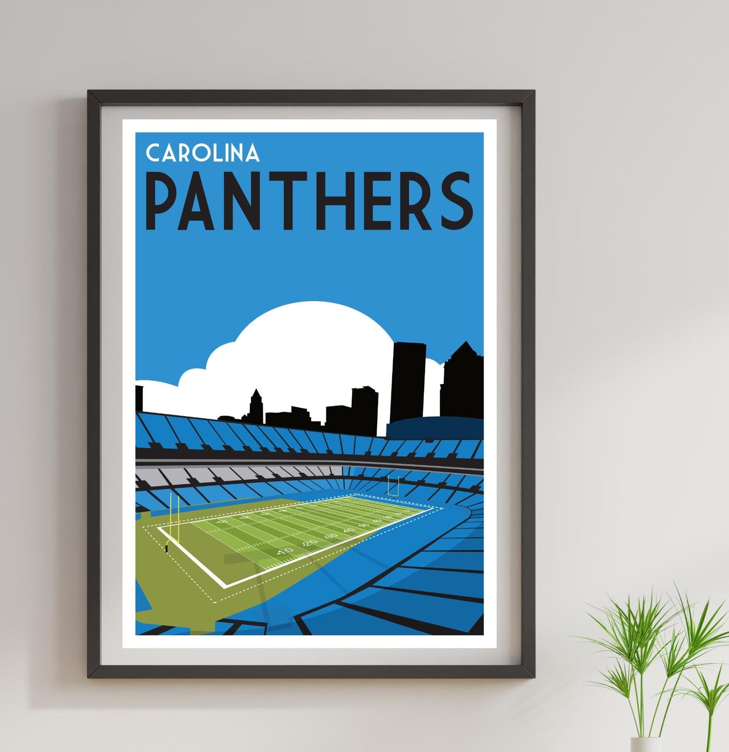 a framed poster of a stadium with a tennis court