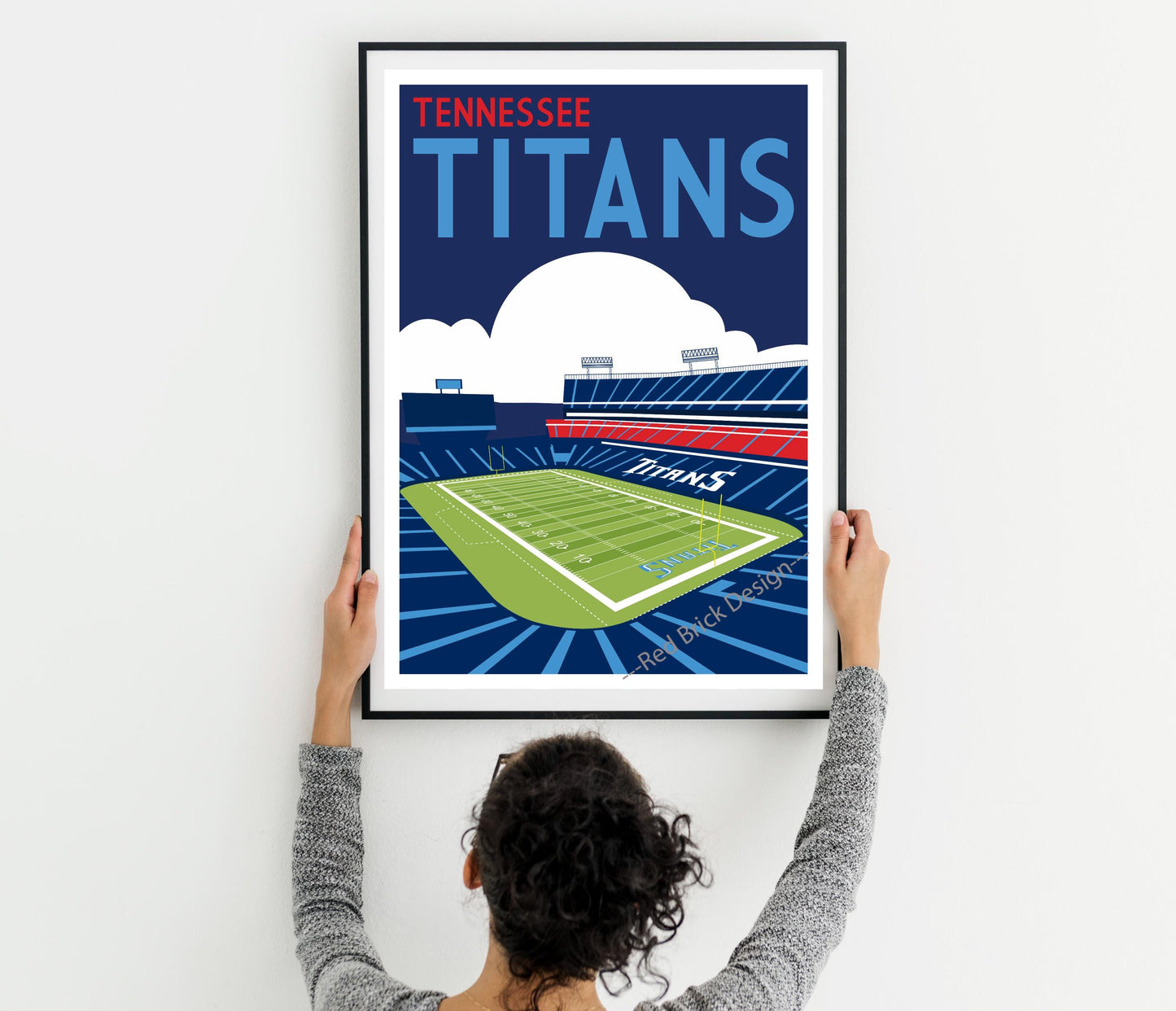 a woman holding up a poster of a tennis court