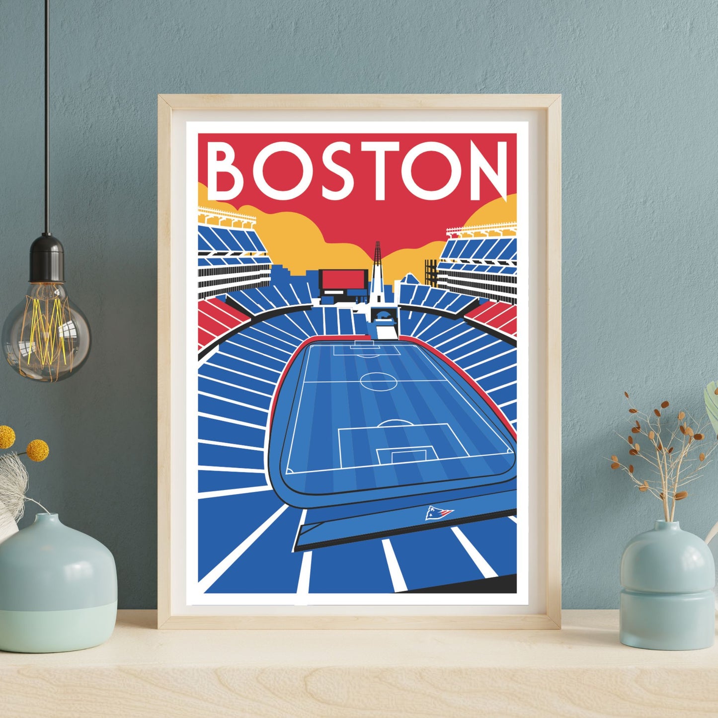 a framed poster of a soccer stadium with the word "BOSTON" prominently displayed.