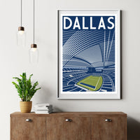 a framed poster of a stadium with a plant on a wooden dresser below it.