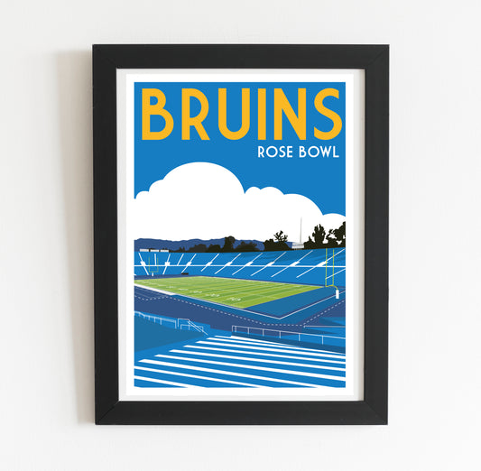 The image is a framed poster depicting a sports stadium, specifically the Bruins Rose Bowl, with a cloudy sky in the background.