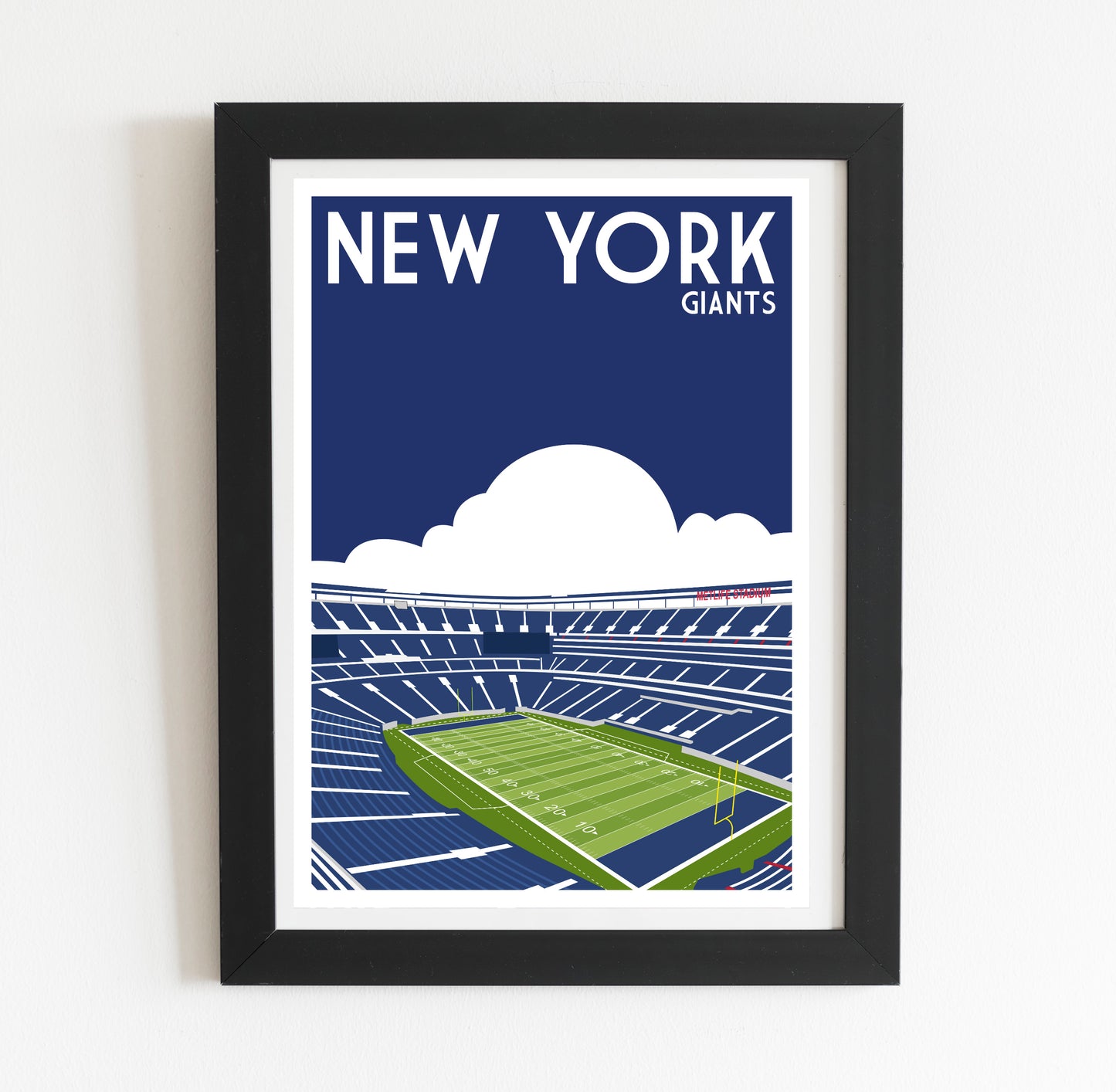 A framed illustration of a football stadium with the text "NEW YORK GIANTS" above it.