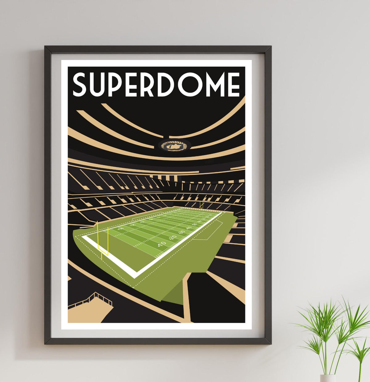 a framed poster of a stadium with a green field