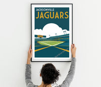 a woman holding up a poster of a tennis court