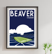 a framed poster of a stadium with a green field
