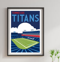 a framed poster of a football stadium