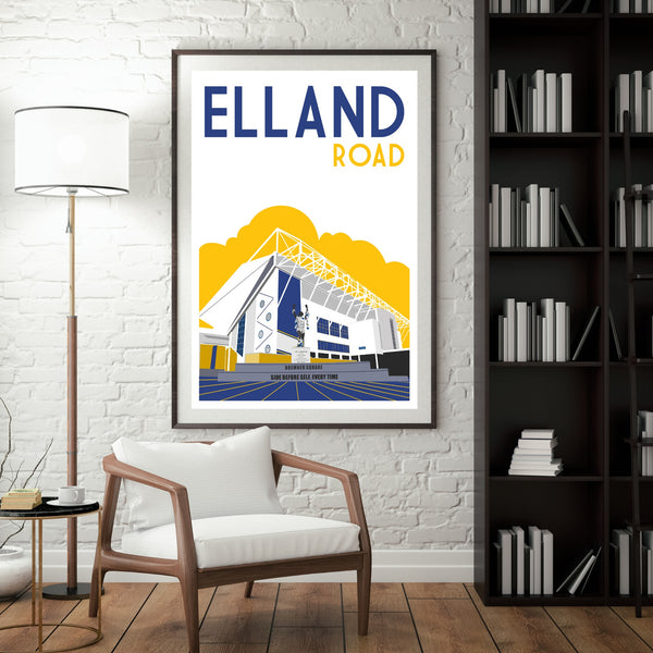 a poster of a stadium, with the text "ELLAND ROAD" prominently displayed. The poster is hanging on a wall, and there is a chair in the foreground.