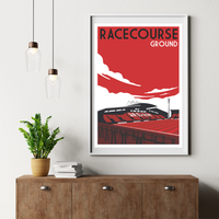 a framed poster of a stadium with the text "RACECOURSE GROUND" on it, hanging on a wall above a wooden dresser.