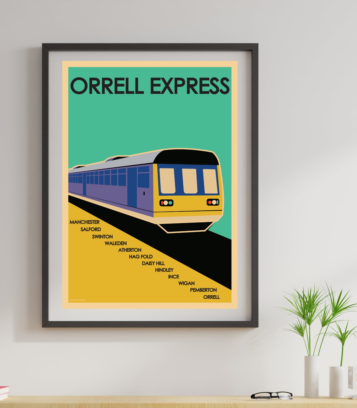 Orrell Express, Wigan: Retro Style Travel Art Print Poster, a picture of a train on a wall a woman holding up a poster with a train on it