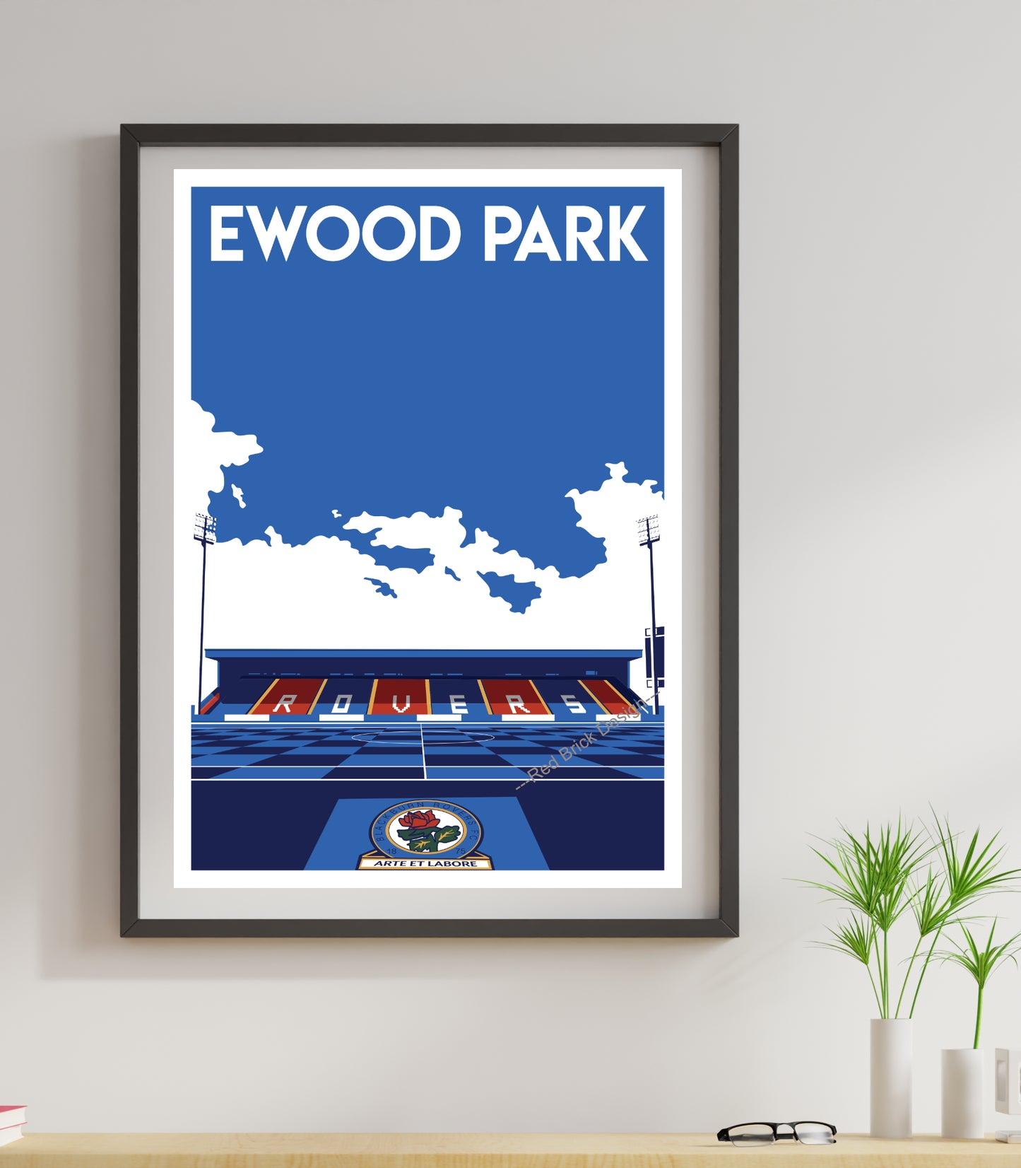 a picture of Ewood Park football stadium print hanging on a wall