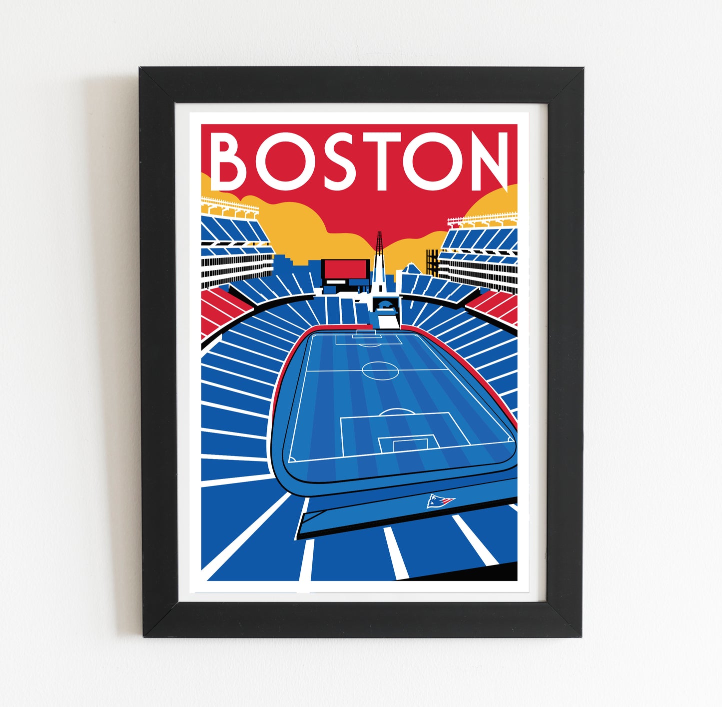 A framed poster depicting a soccer field with the word "BOSTON" written above it.