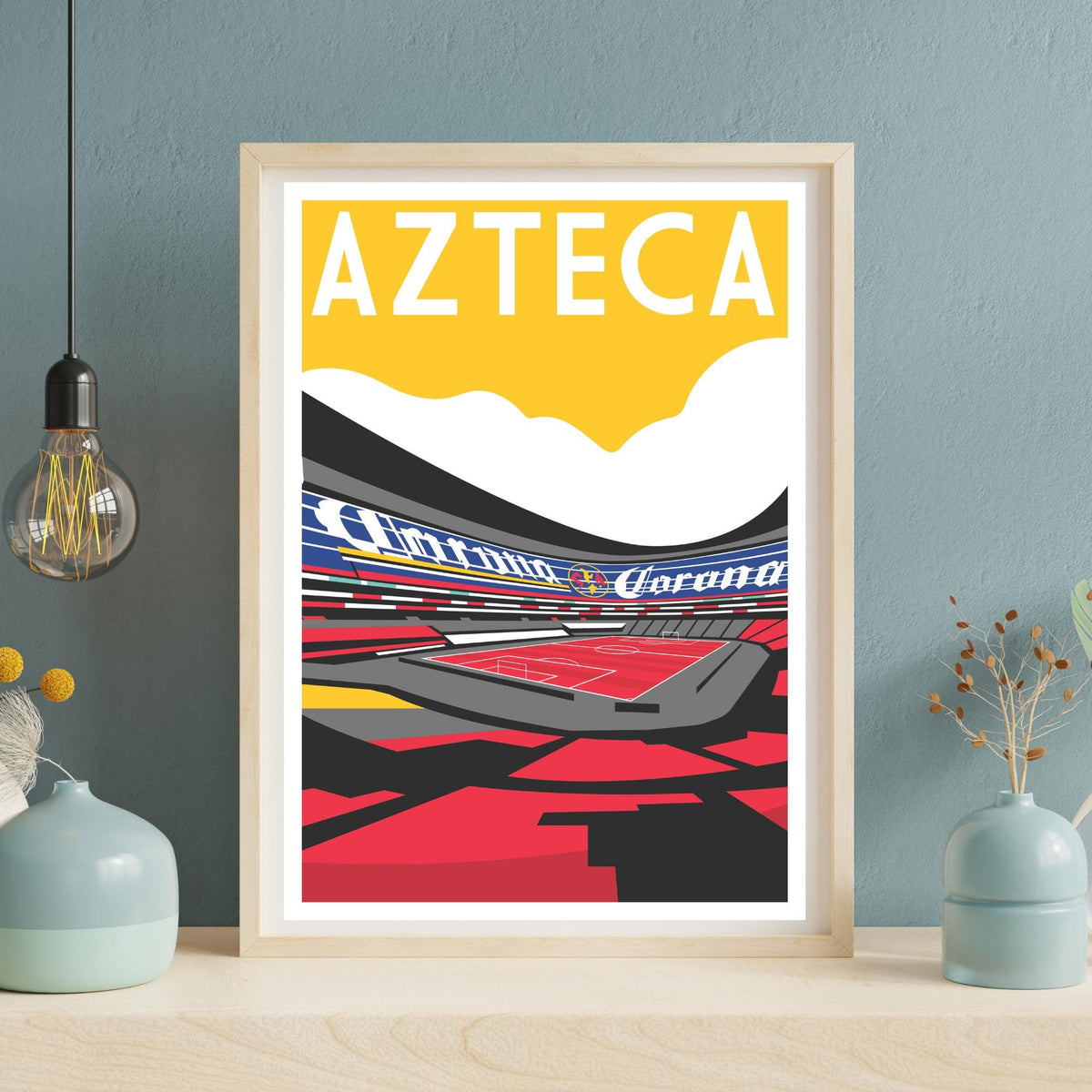 A framed poster depicting a stadium with a large "AZTECA" text in the center, surrounded by a colorful abstract design.