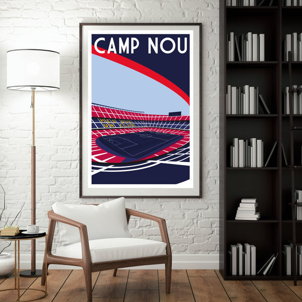 a framed poster of a stadium with a tennis court, hanging on a wall next to a bookshelf filled with books.