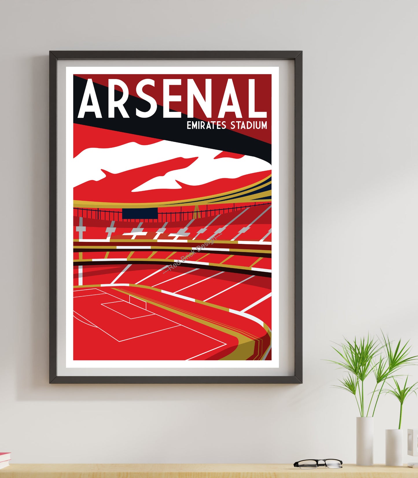 A framed poster of Arsenal Emirates Stadium, featuring a stylized illustration of the stadium's interior.