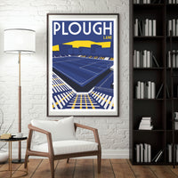 a framed poster of a tennis stadium, with a white chair in the foreground and a bookshelf filled with books in the background.