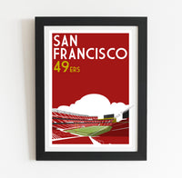 a framed poster of a stadium with a sky background