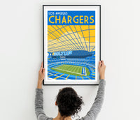a woman holding up a poster of a stadium