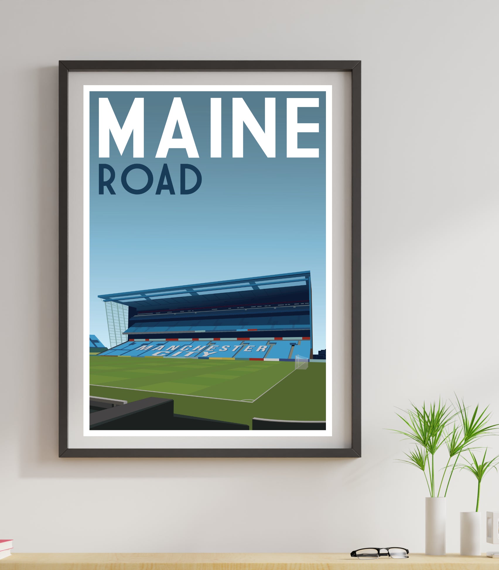 a framed poster of a Maine Road MAnchester City football stadium