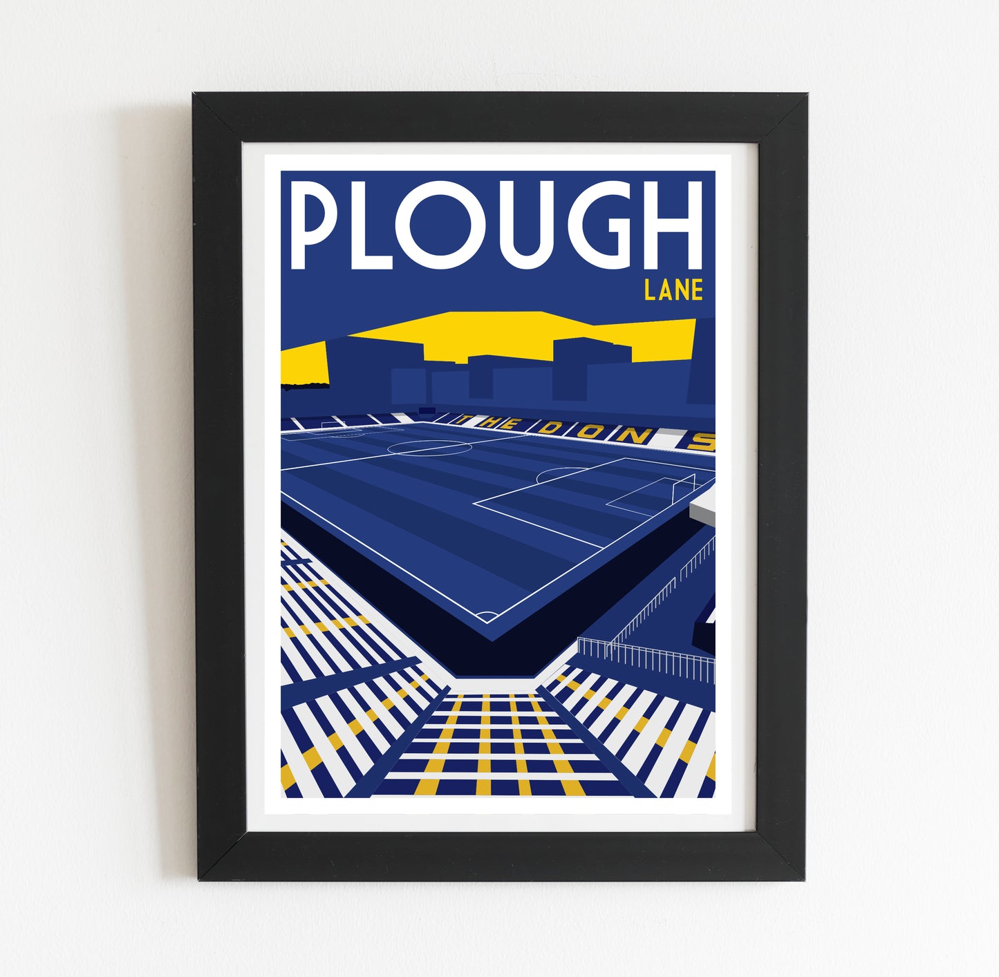 The image is a framed poster depicting a sports stadium, specifically Plough Lane, with a large field and seating area.