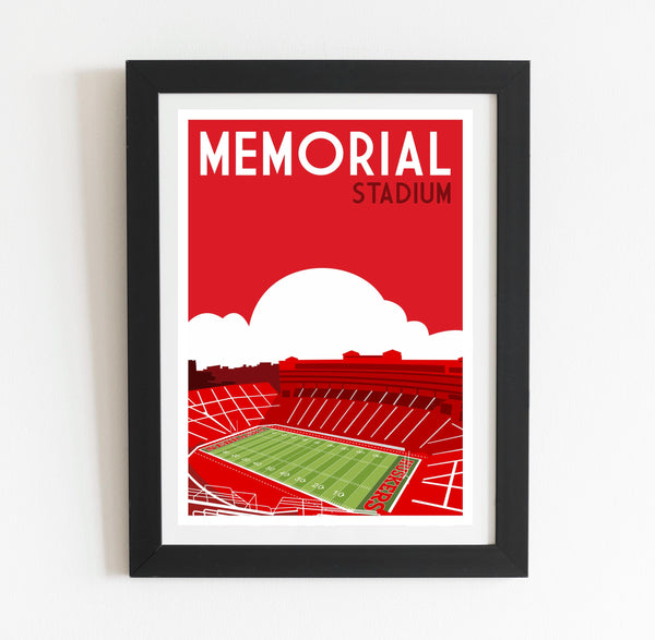 a framed poster of a stadium with a red sky