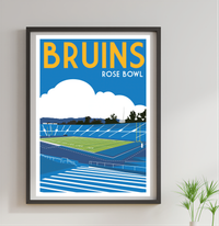 The image is a framed poster depicting a sports stadium, specifically the Rose Bowl, with a cloudy sky in the background.