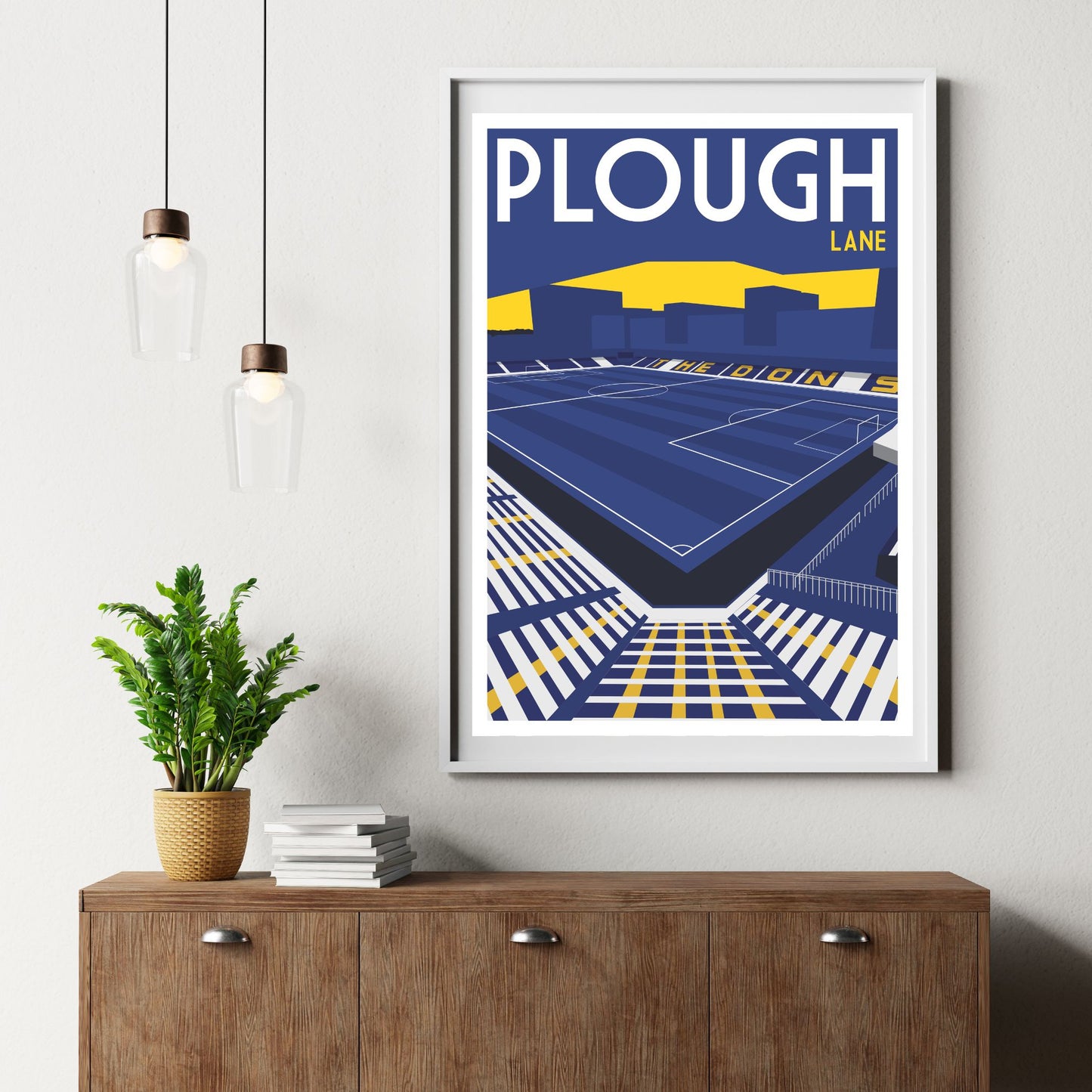 a framed poster of a stadium with the text "PLOUGH LANE" displayed prominently.