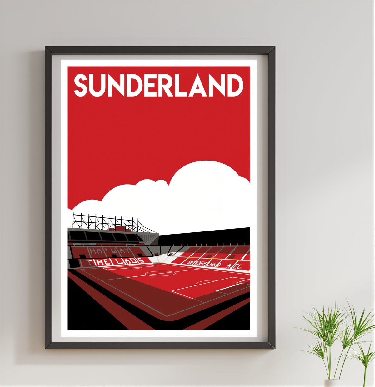 A framed poster of a football stadium with the word "Sunderland" written on it.
