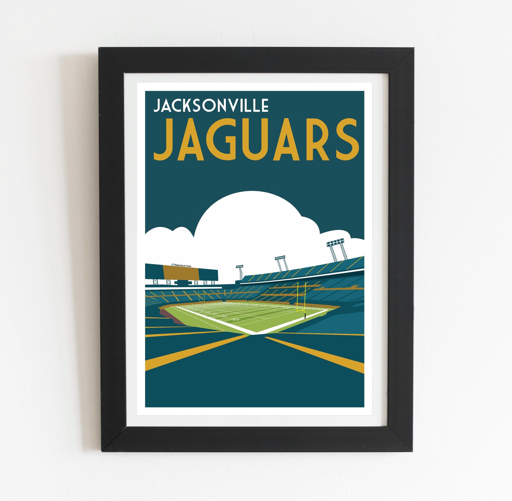 a framed poster of a stadium with a football field