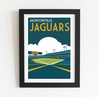a framed poster of a stadium with a football field