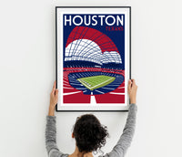 a woman holding up a poster of a stadium